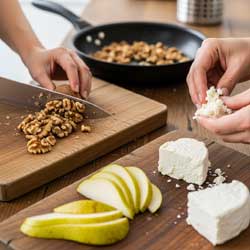 нарезают орехи, сыр и грушу